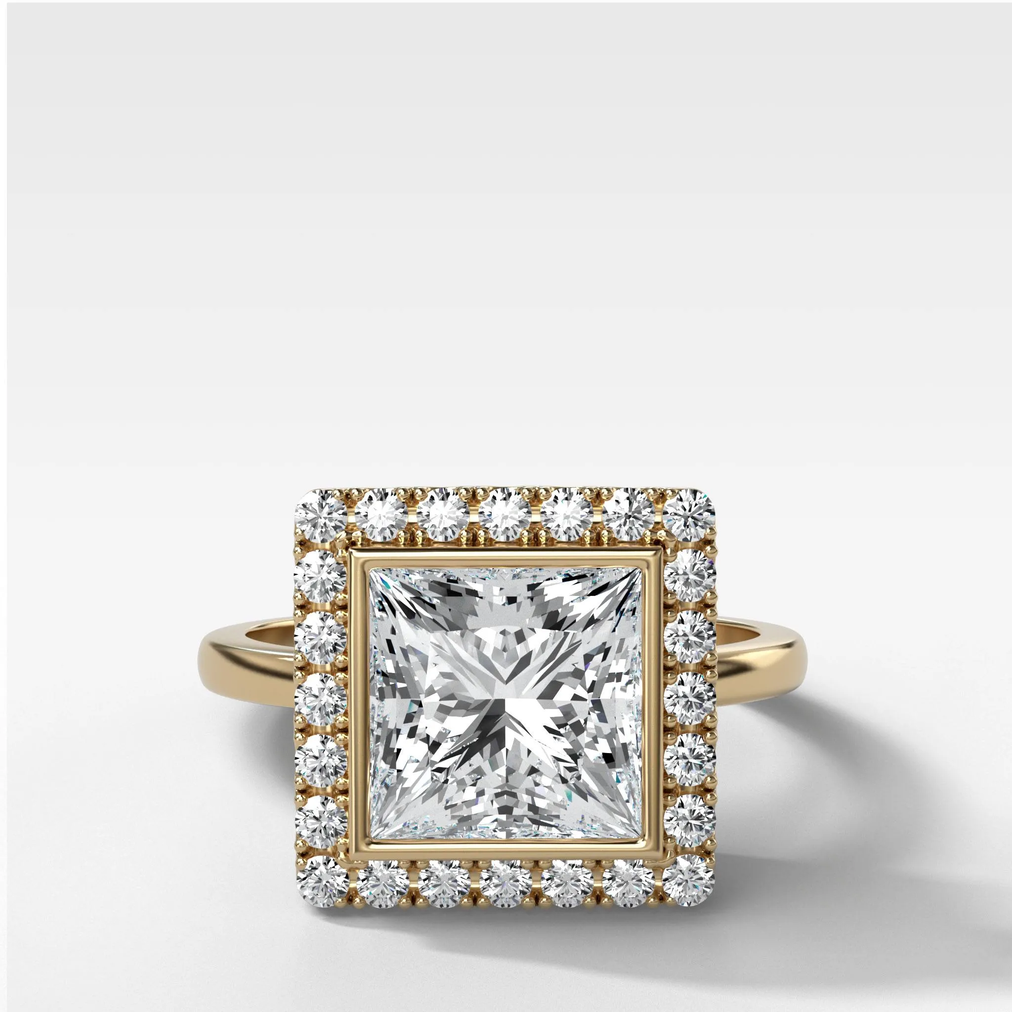 Bezel Set Halo Engagement Ring With Princess Cut Diamond