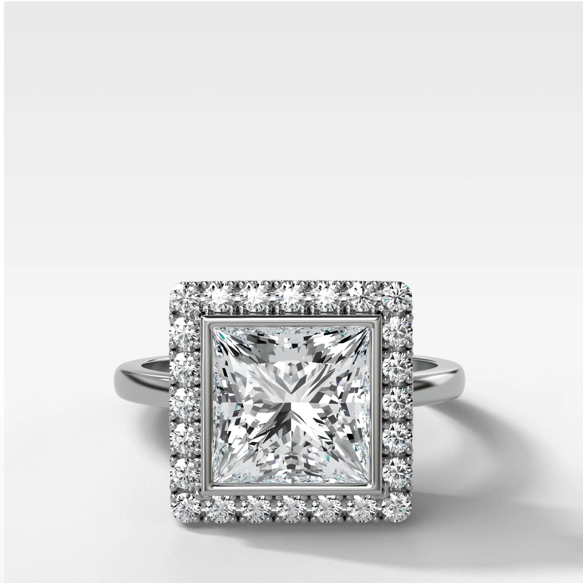 Bezel Set Halo Engagement Ring With Princess Cut Diamond